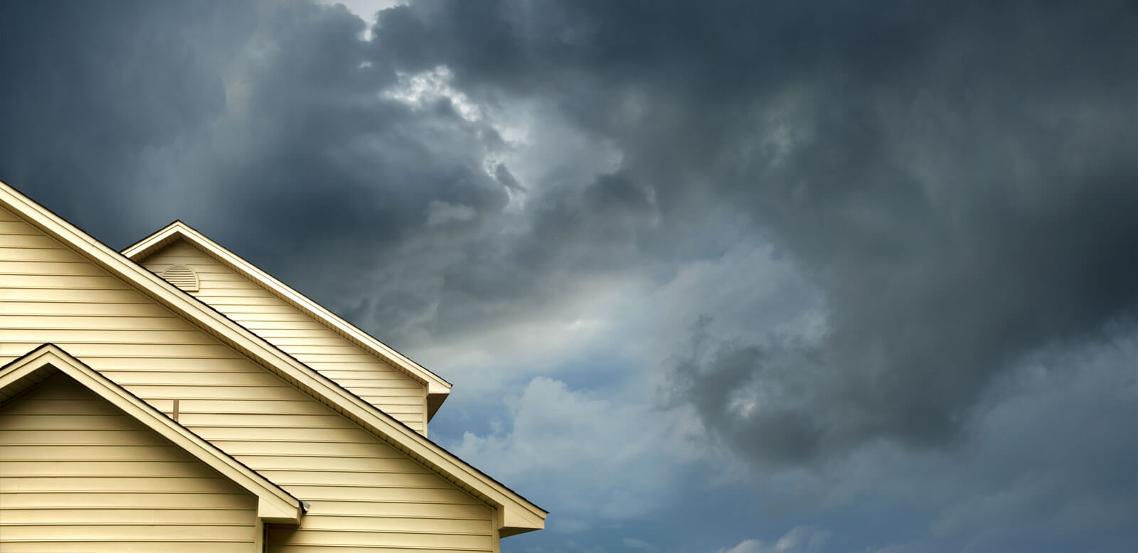 a house under a stormy sky