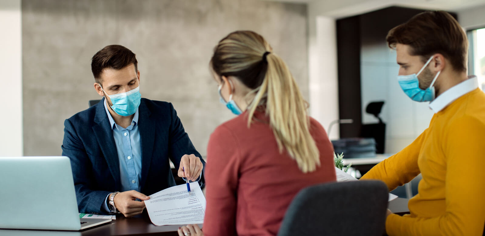 young couple meeting with an insurance agent