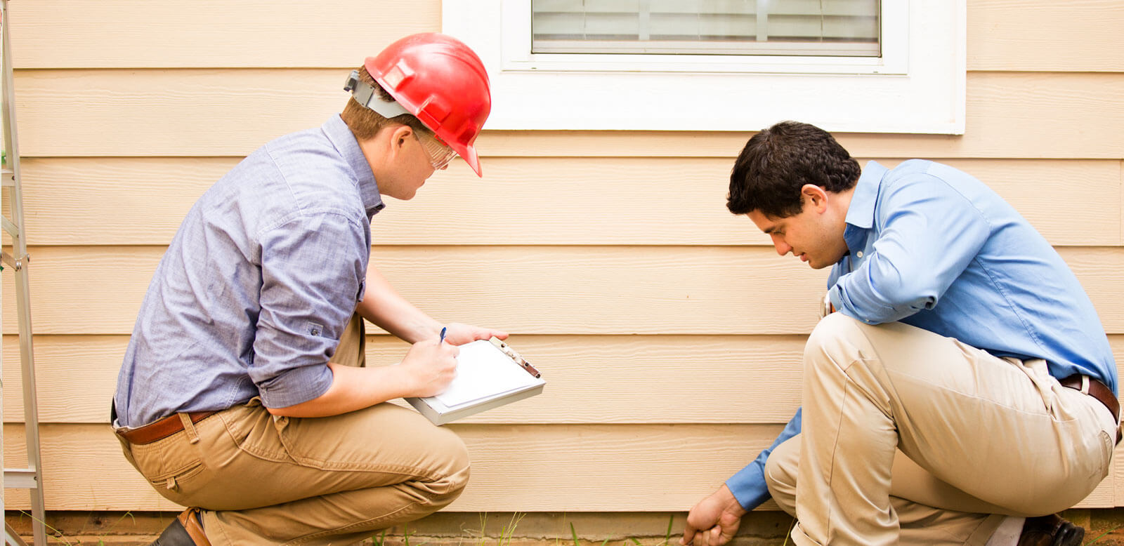 home inspector takes a look at outside of house