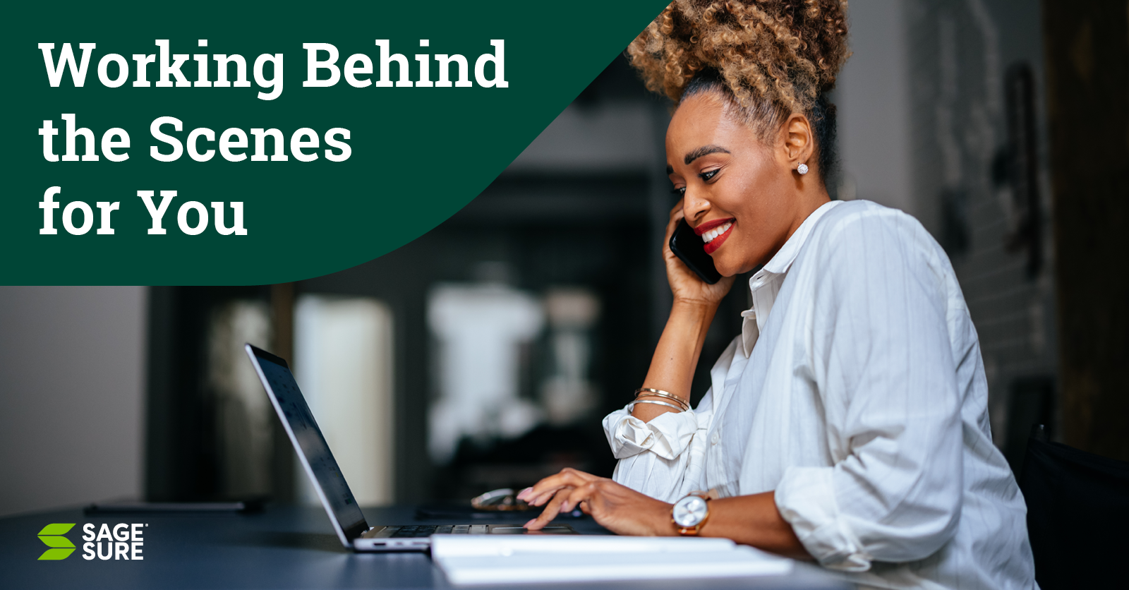 woman on phone at computer